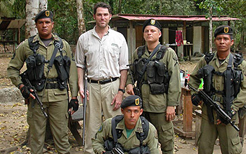 Photo of researcher and a group of soldiers