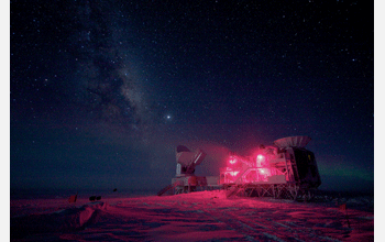 The 10-meter South Pole Telescope and the BICEP Telescope against the night sky with the Milky Way