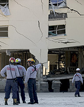 In Pensacola, Fla., engineers check a  building for structural integrity following Hurricane Ivan.
