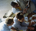 Photo showing three students working at the computer