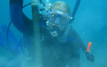 Scientist Hannah Barkley under water collecting samples