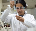 A researcher engages in biotechnology at the Madison Area Technical College in Wisconsin.