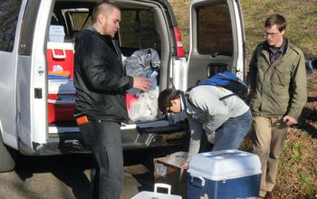 Students pack water samples into a van