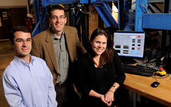 Researchers in front of the Big Blue Baby machine