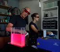 Jack Costello and a colleague conduct research on siphonophores in the laboratory.