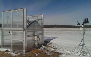A micro-greenhouse and research equipment in the field with snow