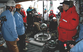 Group of scientist near the end of the construction of IceCube