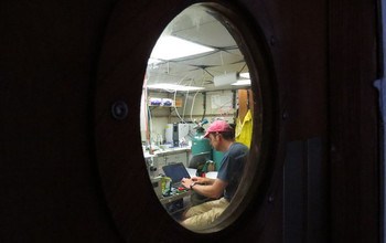 Lead scientist Ben Van Mooy processed data aboard ship late into the evening.