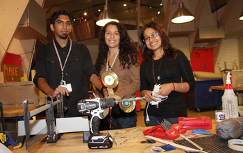 Three young people  working during a  NY Hall of Science project,