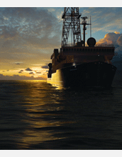 Modernized ocean drillship <em>JOIDES Resolution</em> at sunrise
