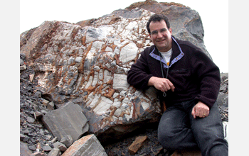 Alan Jay Kaufman in front of a neoproterozoic collapse breccia in Argentina.
