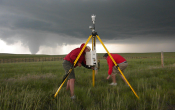 The Vortex2 team deploys a StickNet probe in the path of a tornado in Goshen County, Wyo.
