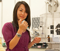 Scientist Pei-I Ku prepares a sample for a digital microscope used in the AIDS virus research.