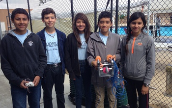 Children in a Sea Perch team with a remotely operated vehicle.