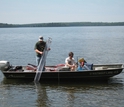 Two scientists in a boat take water samples from Trout Lake in northern Wisconsin.