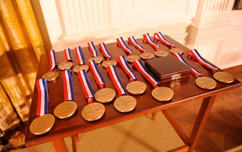 national science medals on a table