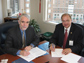 Photo of Tim Killeen of NSF and Rick Fritz of AAPG signing new agreement.