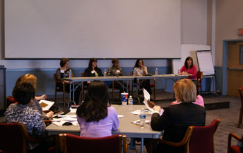 Photo of ACTiVATE alumnae sharing experiences with a new class.