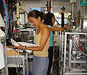 Photo of Stephanie King and Qi Chen of Harvard University working on aerosol instrumentation.
