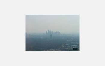 Photo of Houston's downtown skyline obscured by air pollution.