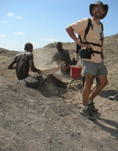 Photo of field crew sieving for fossils with geologist Jonathan Wynn.