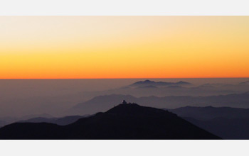 The telescopes of the Cerro Tololo Interamerican Observatory at sunset, taken from Cerro Pachon.