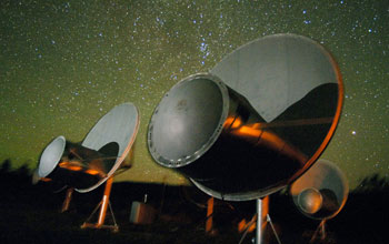 Telescopes of the Allen Telescope Array (ATA) with Milky Way rising in the sky above