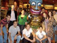 Photo of nine undergraduate students and their professor posing by a statue.