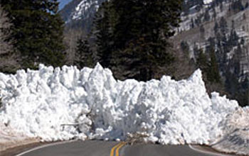 Photo of pile of snow from avalanche blocking Utah's highway 210 is avalanche.