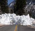 Photo of pile of snow from avalanche blocking Utah's highway 210 is avalanche.