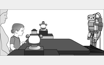 Morphy looks at a toy while researchers measure whether a baby will follow the robot's gaze.