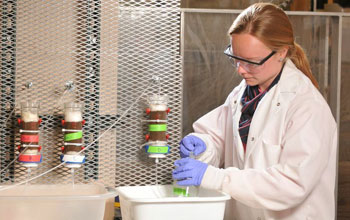 Researcher conducting experiments in a lab.