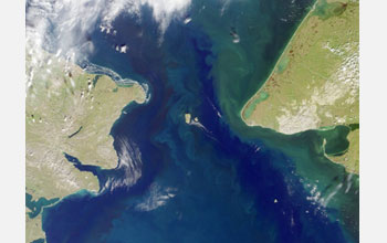 Satellite image showing the Bering Strait with U.S. on the right and Russia on the left.