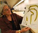 Curator Kathy Ann Miller looks at seaweed collected along the coast of Washington.