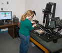 Photo of a researcher taking a high-quality image of a specimen.