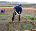 Photo of scientist David Hooper of Western Washington University conducting grassland research.