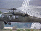 Photo of a Blackhawk helicopter lifting off in front of the Robert C. Byrd Green Bank Telescope.