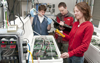 Researchers Matt George, Michael O'Donnell and Rebecca Guenther in the lab testing water