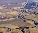 the California Aqueduct in dry farmland.