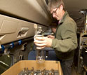 Geoscientist Ralph Keeling replaces used flasks filled with air samples