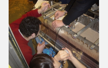 Researchers place references in the sample chamber to accurately track soil movement.