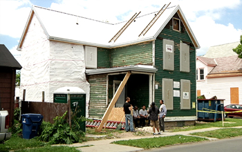 Photo of a house in inner-City Buffalo being restored by good-paying green jobs.