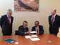 Sebastian Pinera, Jose Miguel Aguilera, Subra Suresh signing of the GROW agreement at a table.