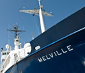 Photo of the Melville underway on an oceanographic expedition.