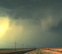 Storms clouds on a dark sky above a road