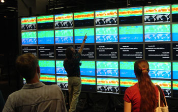 Photo of someone using the HiPerWall display at the University of California, San Diego.