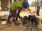 Woman cooking over an open fire