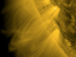 Images showing narrow jets of material streaking upward from the Suns surface at high speeds.