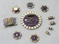 Photo of a circular array of sewable electronic components forming an interactive embroidery.