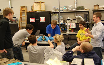 The scientific team assemblying the RAX cubesat.
